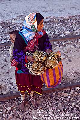 Local Tarahumara women and children sell baskets and other hand crafted souveniers on the San Rafael train station.